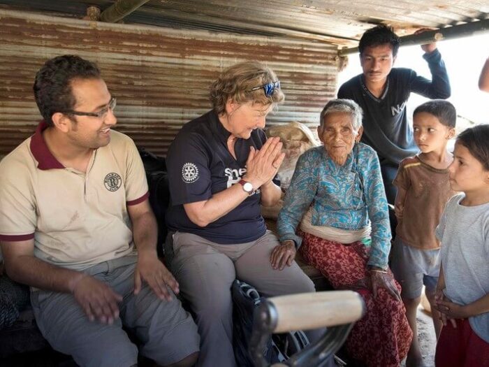 Shelterbox relief team with a family in Nepal
