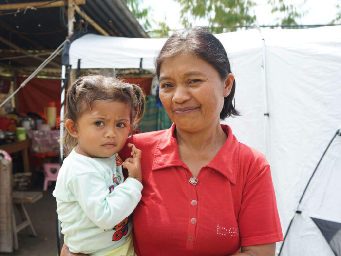 Indonesian woman holding child