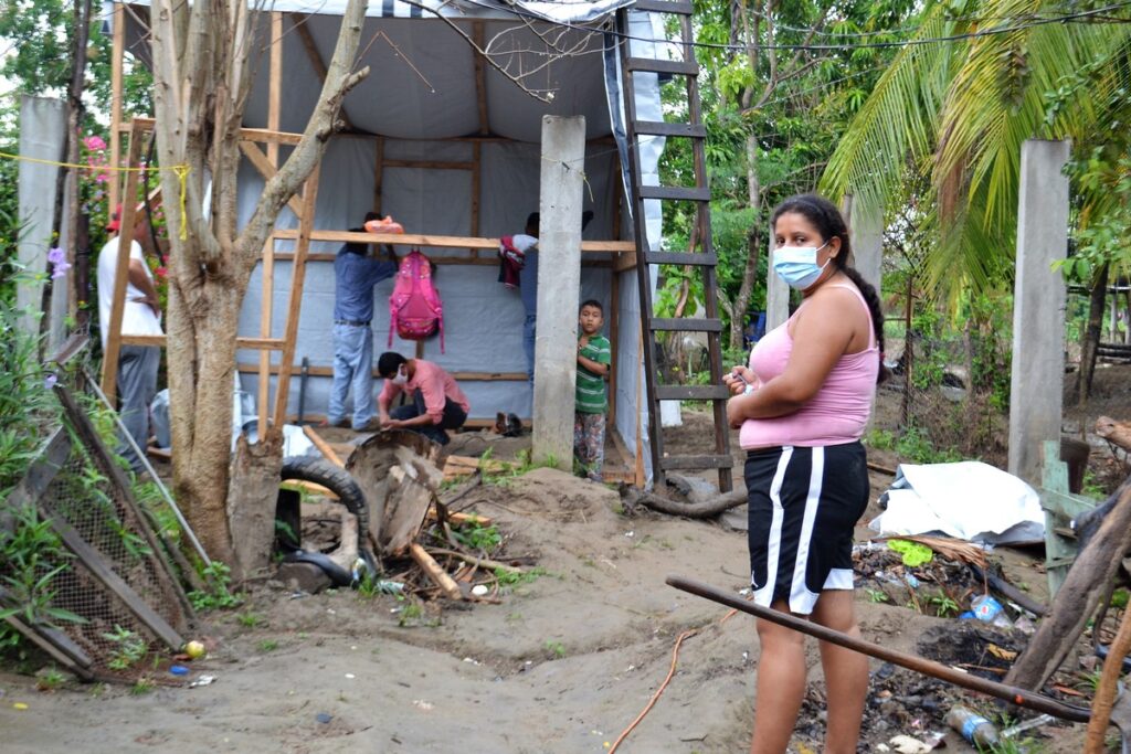 A family rebuilding their home with ShelterBox aid in Honduras after two Hurricanes battered parts of the country.