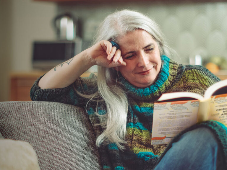 woman reading for ShelterBox Book Club