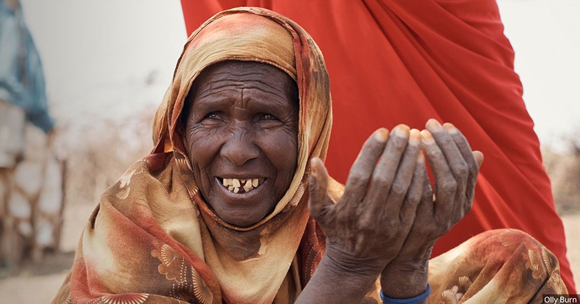Woman wearing orange head scarf in Somaliland