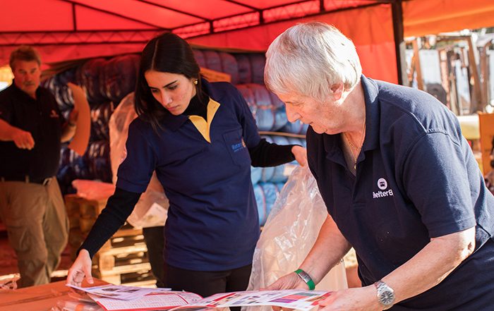People sorting leaflets in Paraguay