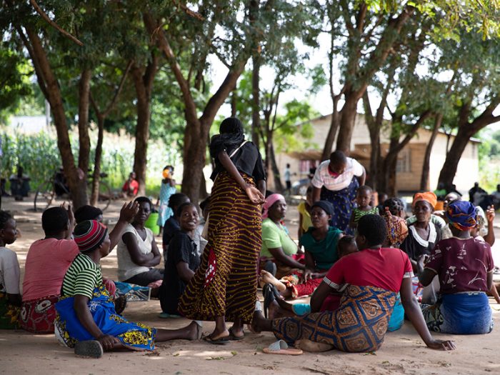 Group pf people sitting on the floor in Malawi
